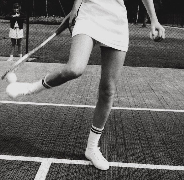 Archival black and white tennis court scene